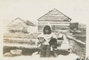 Image of Eskimo [Inuit] boy with pup